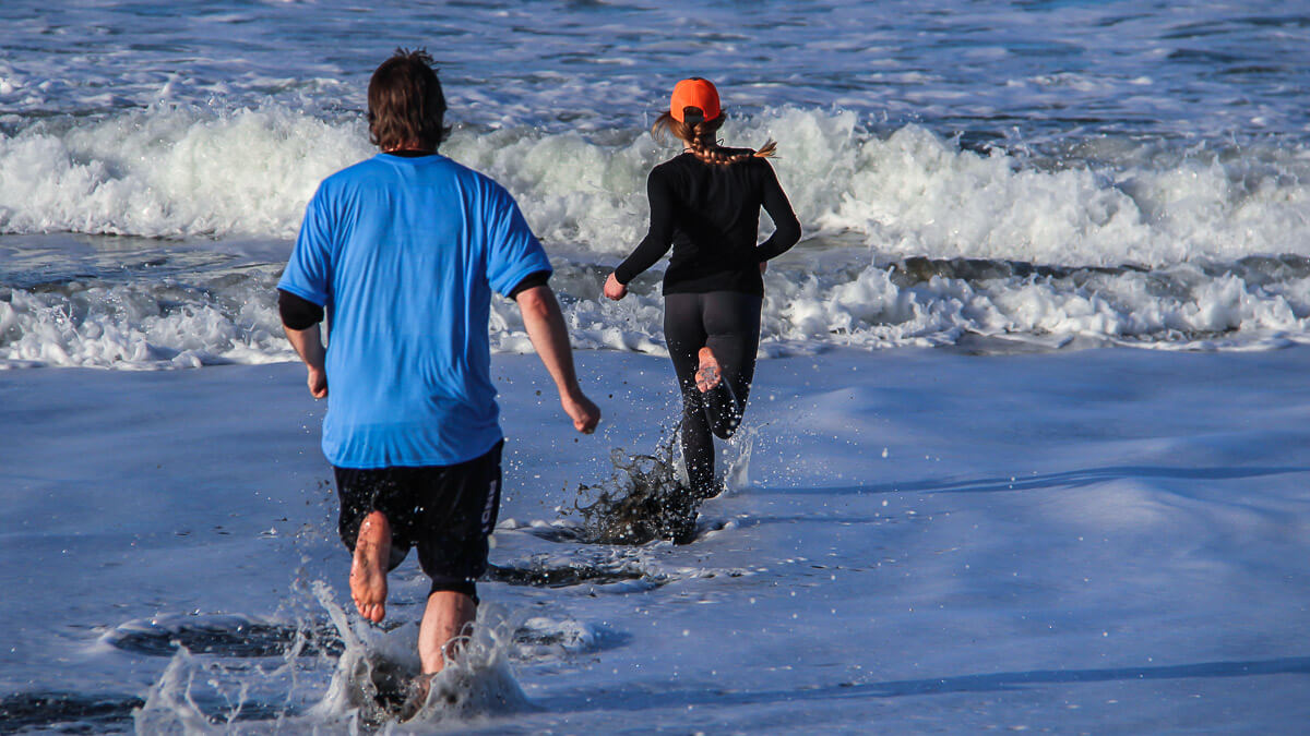 Participants plunging into the ocean.