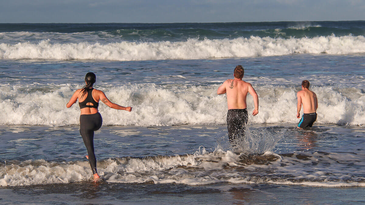 Participants plunging into the ocean.