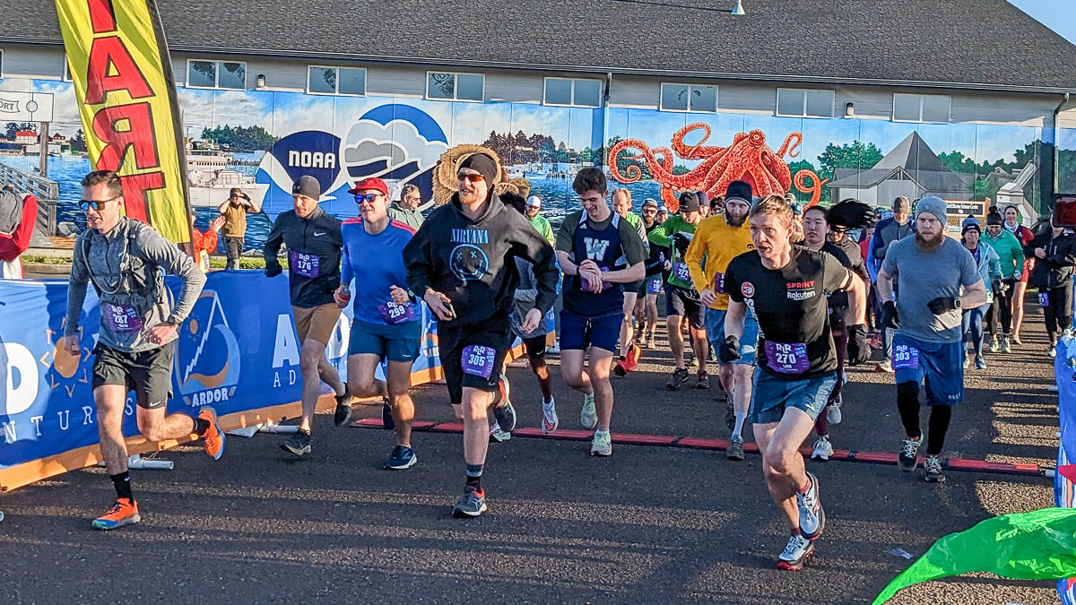 A couple celebrating at the finish line.